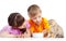 Children boy and girl feeding attractive kitten