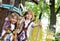 Children - a boy and a girl in the rope park pass obstacles