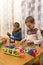 Children Boys playing with construction set on the floor.Educational games for kids. Boys playing whit blocks