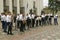 Children brass orchestra playing music on a square, conductor leading. Fest of brass orchestras. Kyiv, Ukraine