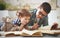 Children brother and sister, boy and girl reading a book