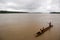 Children at canoe muddy river