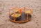 Children carousel on beach with wet sand