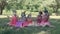 Children celebrate their birthday. A group of girls in medical masks in the park