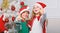 Children cheerful celebrate christmas. Kids christmas costumes santa and elf. Winter masquerade concept. Siblings ready