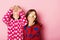 Children with cheerful and loose hair. Kids pose on pink background. Childhood, friendship and happiness