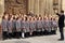 Children choir singing Christmas carols in front of the Bath Abbey