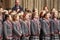 Children choir singing Christmas carols in front of the Bath Abbey