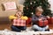 children choose gifts Christmas tree joyful emotions
