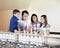 Children Choosing From Ice Cream Cups And Cones With Parents