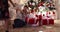 Children with Christmas presents under the Christmas tree.