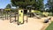 Children colored green and steel wooden slides colorful playground on park street