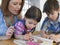 Children Coloring Book While Mother Assisting Them