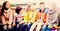 Children communicate sitting on bench in yard