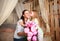 Children congratulate mother give her bouquet of flowers