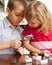 Children are considering a magnifying glass stones