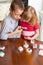 Children are considering a magnifying glass stones