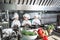 Children cook eggs in the kitchen at the Restaurant.