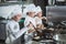 Children cook eggs in the kitchen at the Restaurant.