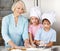 Children cooking with grandmother