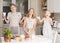 Children cooking making pizza at home. Teen boy and his sisters having fun in the kitchen. People  teenagers and leisure concept