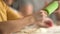 Children cooks pizza. Boy and girl having fun with father. Prepering ingredients for pizza.