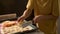 Children cooks pizza. Boy and girl having fun with father. Prepering ingredients for pizza.