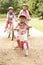 Children In Countryside Wearing Safety Helmets