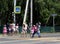 Children cross the road at a pedestrian crossing in the village of Mayma of the Altai Republic