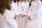 children with crosses on its neck, praying hands