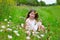 Children cute girl on spring meadow with poppy flowers