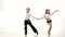 Children dance rhythmically latin american dance. White background. Slow motion