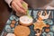 Children decorate cookies for New Year and Christmas