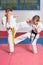 Children demonstrate martial arts working together