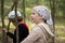 Children discover the forest while hiking along the summer paths of green woods.