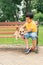 Children and dogs outdoors. Asian little boy enjoying and playing in park with his adorable Pembroke Welsh Corgi