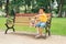 Children and dogs outdoors. Asian little boy enjoying and playing in park with his adorable Pembroke Welsh Corgi