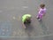 Children drawing on asphalt