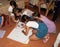 Children drawing a painting on the paper