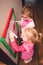 Children drawing a pictures learning a letters playing together using whiteboard and markers