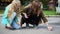 Children drawing with the piece of chalk