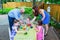 Children Dyeing Easter Eggs with Mother and Father