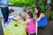 Children Dyeing their Easter Eggs Outside