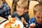 Children eat Italian pizza in the cafe