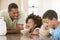 Children Eating Breakfast With Dad