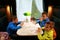 Children eating burgers in compartment of train carriage