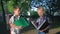 Children education, schoolchildren boy and girl with books in hands read after lessons standing in park