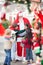 Children Embracing Santa Claus