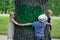 Children embracing tree. Environmental protection outdoor nature. Conservation outdoors