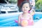 children enjoy and have fun playing water in inflatable pool with colorful of small balls